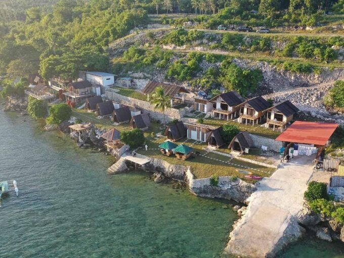 Aerial view of the operating beach resort for sale in Dalaguete, Cebu, along a rocky shoreline