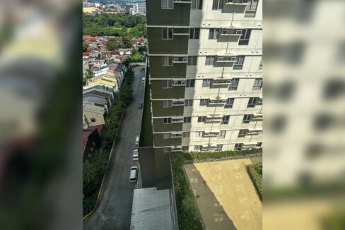 Driveway and neighboring tower seen from the window