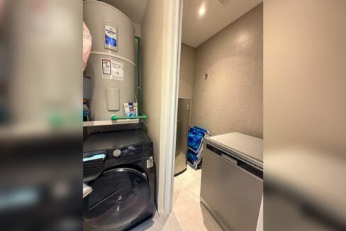 Laundry room with front-load washer and water heater