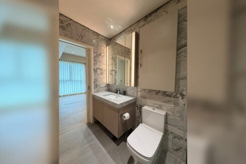 Second bathroom with marble vanity and lit mirror cabinet