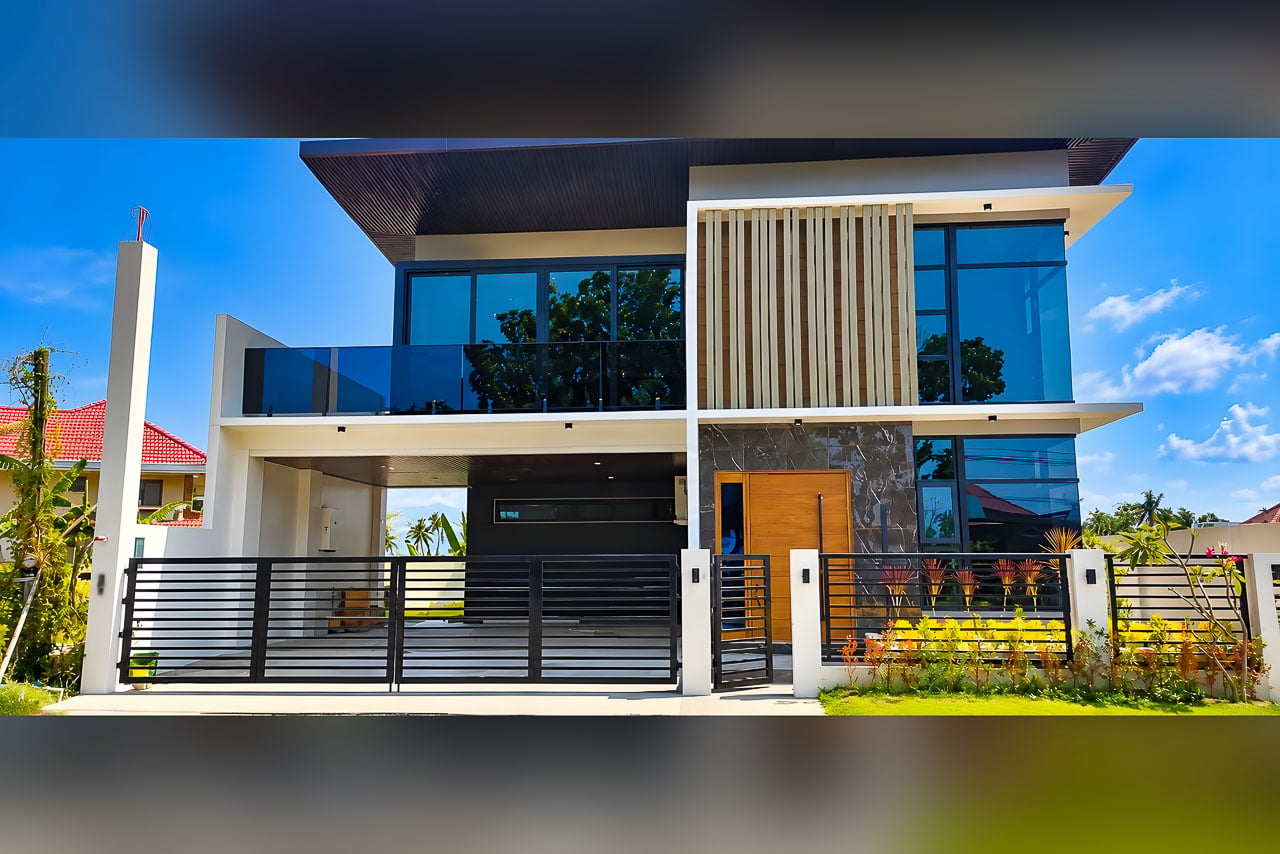 Modern house and lot for sale at Corona del Mar, Talisay City with glass balcony and wood-slat facade