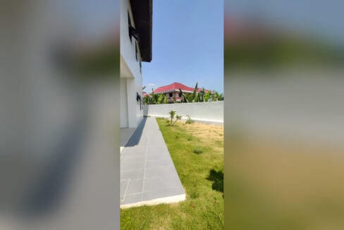 Tiled side walkway beside the garden lawn of the Talisay City house and lot