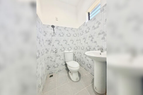 Mosaic-tiled shower room with a pedestal sink, Cordova house for sale