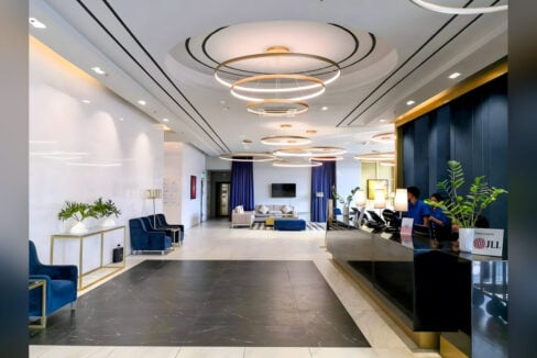 Grand Residences lobby with a reception desk and lounge seating