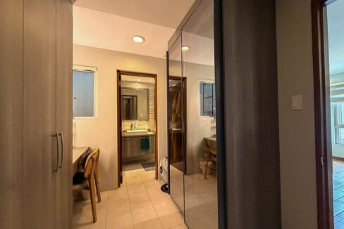 Closet passage leading to the master bathroom