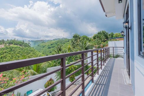 Balcony overlooking green hillsides in Cadulawan, Minglanilla