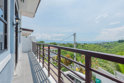 Balcony at Ricksville Heights with views over the hills to the sea
