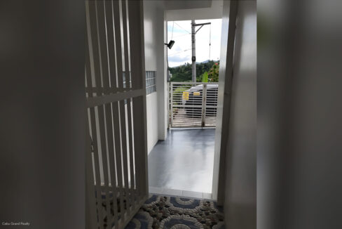 Entry passage leading from the house to the front gate