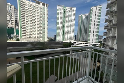 Balcony view over the garden lawns toward the towers of Cebu Business Park