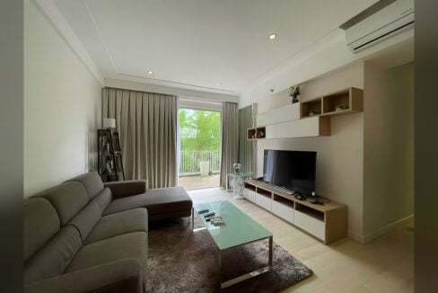 Living room with sliding glass doors opening to the private garden at 32 Sanson