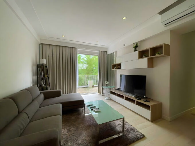 Living room with sliding glass doors opening to the private garden at 32 Sanson